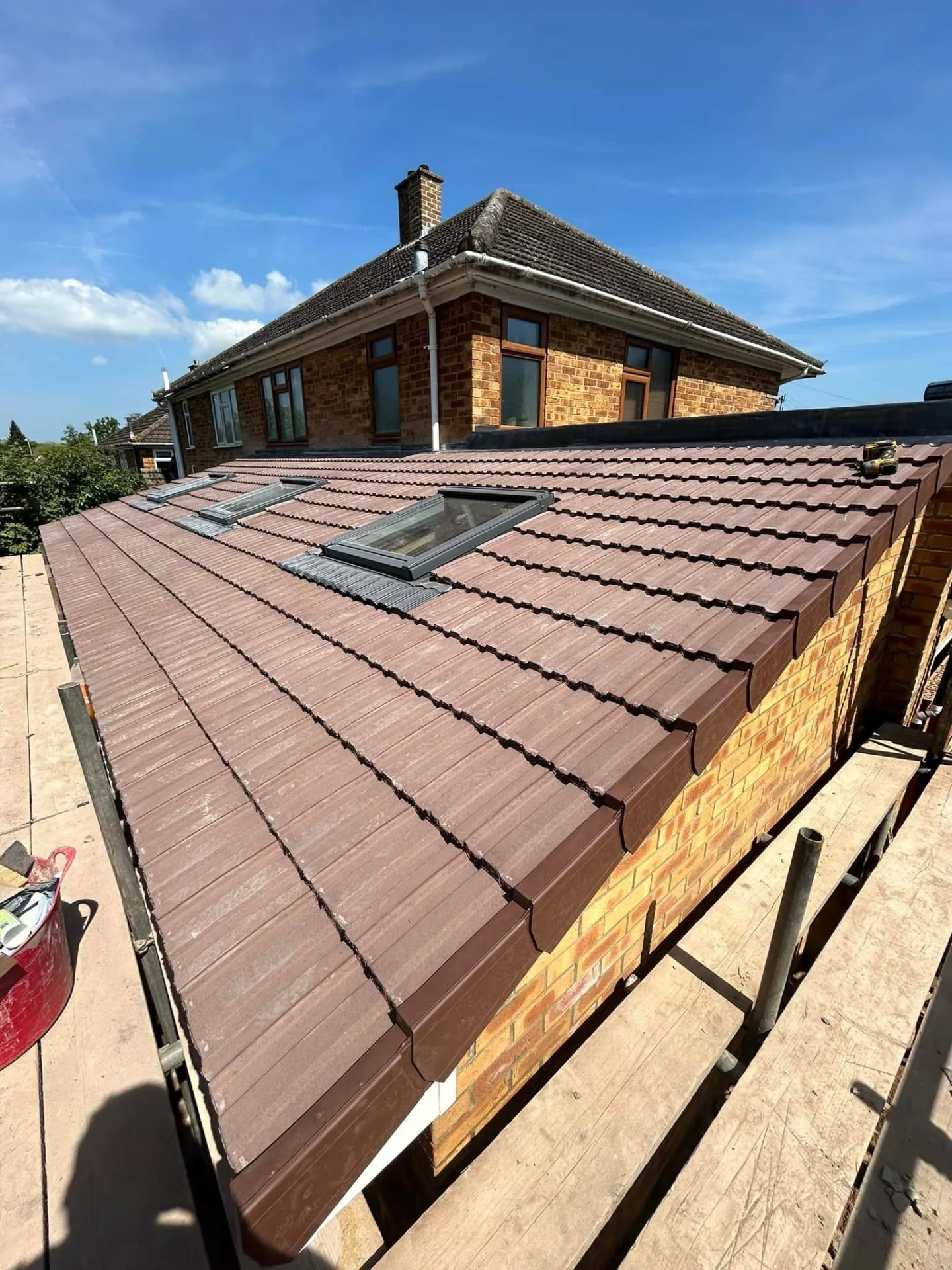 Freshly re-roofed house with new tiles and flashings