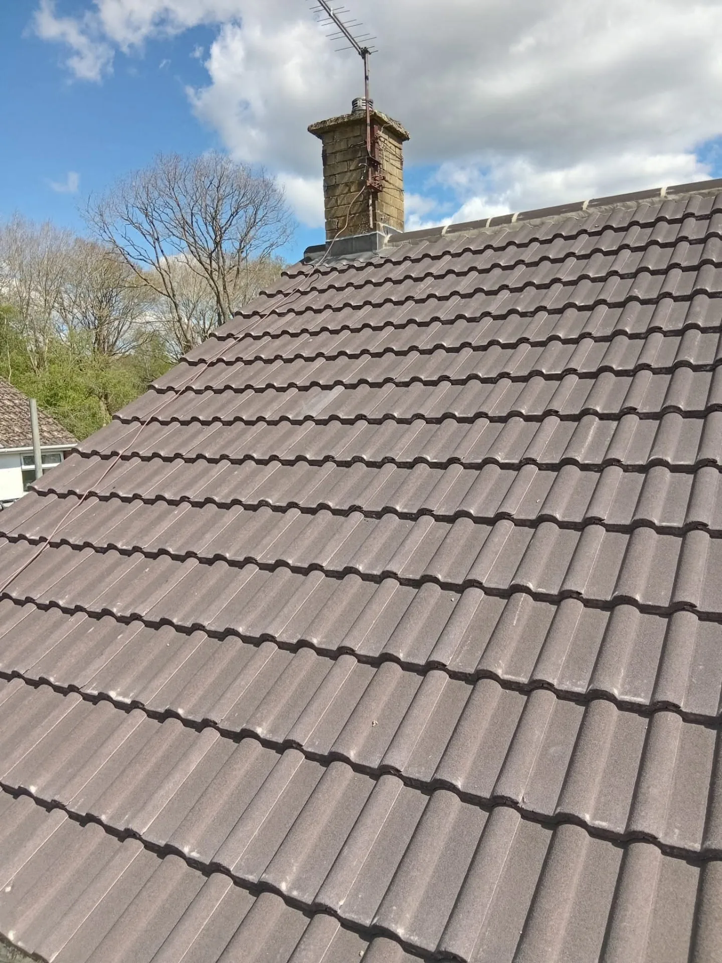 New tiled roof finished with neat verges and ridge