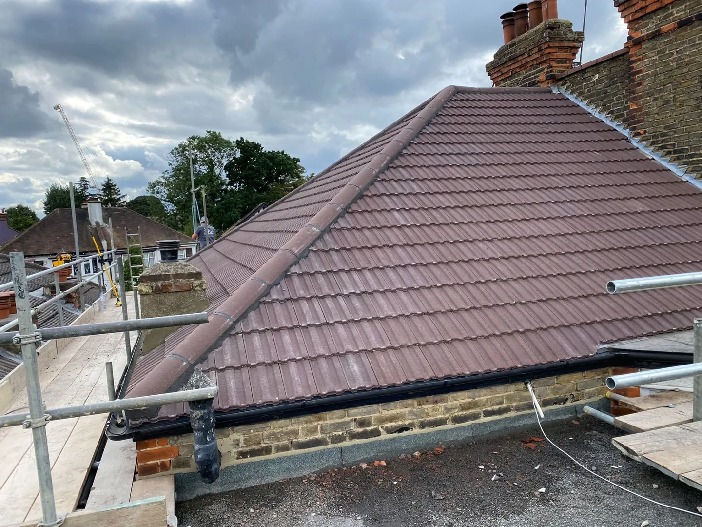 Completed roof replacement seen from the driveway